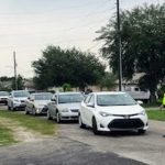 Cars-Lined-Up-Timber-Village-Road