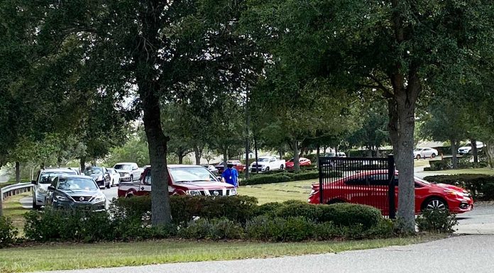 Hundreds Of Cars Line Up At Real Life Christian Church. People Awaiting To Be Tested For COVID.