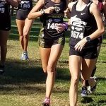 Mackenzie in a group on the grassy straightaway