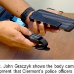 Capt. John Graczyk shows the body camera