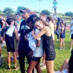 Sophomore Rhyen Foley and Freshman Taylor Walker proud of their efforts and medals after the varsity race