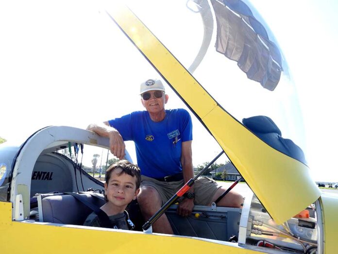 EAA CHAPTER 534 pilot, Steve Tilford has his Young Eagle Sebastian Davila strapped in for his flight